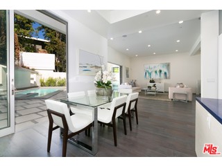 12263 Renfrew Road Los Angeles, CA 90049 - Photo 13 of 42 a view of a dining room with furniture and wooden floor