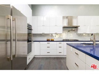 12263 Renfrew Road Los Angeles, CA 90049 - Photo 14 of 42 a kitchen with cabinets stainless steel appliances and a counter