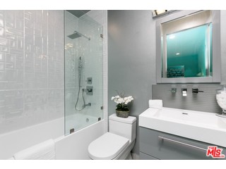 12263 Renfrew Road Los Angeles, CA 90049 - Photo 19 of 42 a bathroom with a sink toilet and shower
