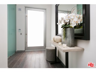 12263 Renfrew Road Los Angeles, CA 90049 - Photo 3 of 42 a view of bathroom with a sink and mirror
