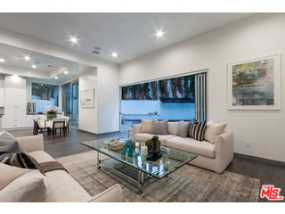 12263 Renfrew Road Los Angeles, CA 90049 - Photo 39 of 42 a living room with furniture and a large window
