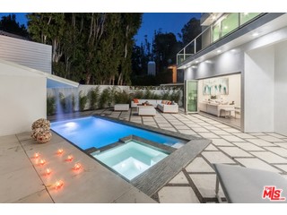 12263 Renfrew Road Los Angeles, CA 90049 - Photo 40 of 42 a living room with lots of furniture and kitchen view