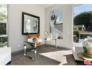 12263 Renfrew Road Los Angeles, CA 90049 - Photo 4 of 42 a living room with furniture and a painting on the wall