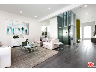 12263 Renfrew Road Los Angeles, CA 90049 - Photo 6 of 42 a living room with furniture and wooden floor