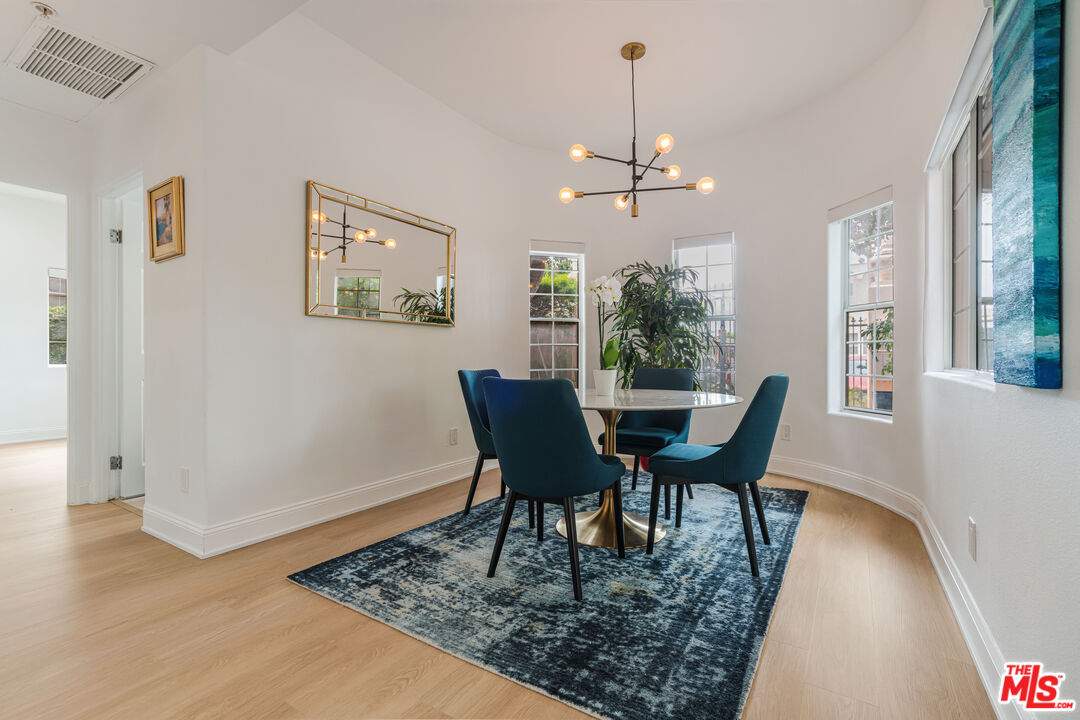 1531 12th Street, Unit 1 Santa Monica, CA 90401 - Photo 13 of 21 a view of a dining room with furniture window and wooden floor
