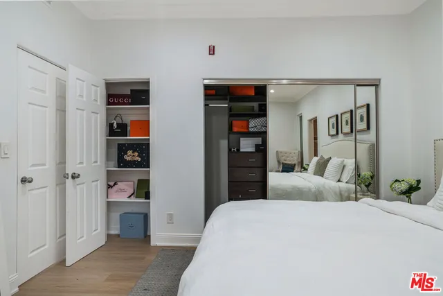 a bedroom with a bed and a cabinets