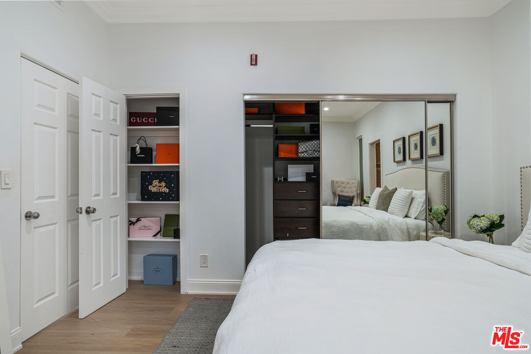 1531 12th Street, Unit 1 Santa Monica, CA 90401 - Photo 15 of 21 a bedroom with a bed and a cabinets