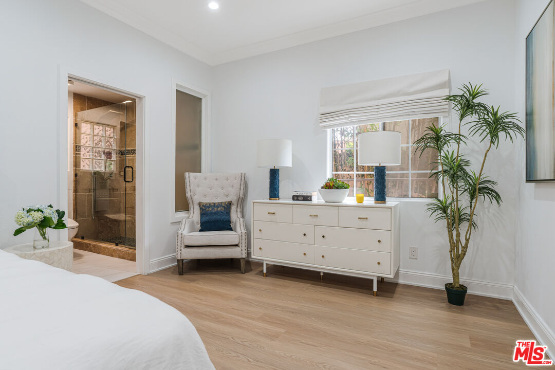 1531 12th Street, Unit 1 Santa Monica, CA 90401 - Photo 16 of 21 a bedroom with a bed and a potted plant