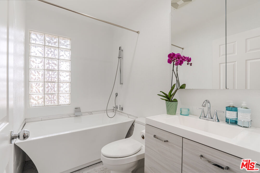 1531 12th Street, Unit 1 Santa Monica, CA 90401 - Photo 20 of 21 a bathroom with a sink a toilet and tub