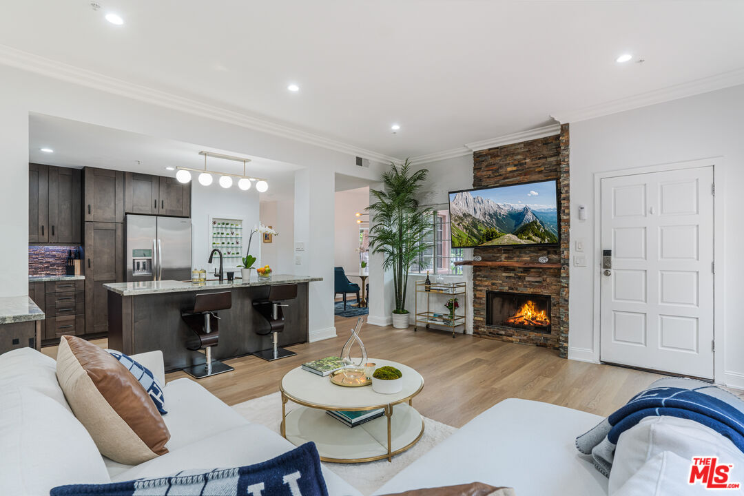 1531 12th Street, Unit 1 Santa Monica, CA 90401 - Photo 2 of 21 a living room with furniture and a fireplace
