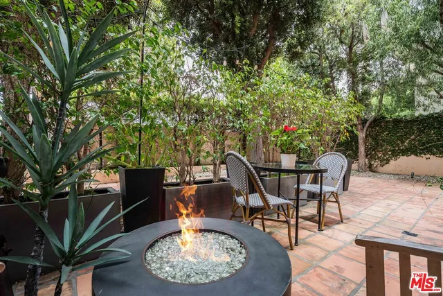 a view of a chairs and tables in the patio