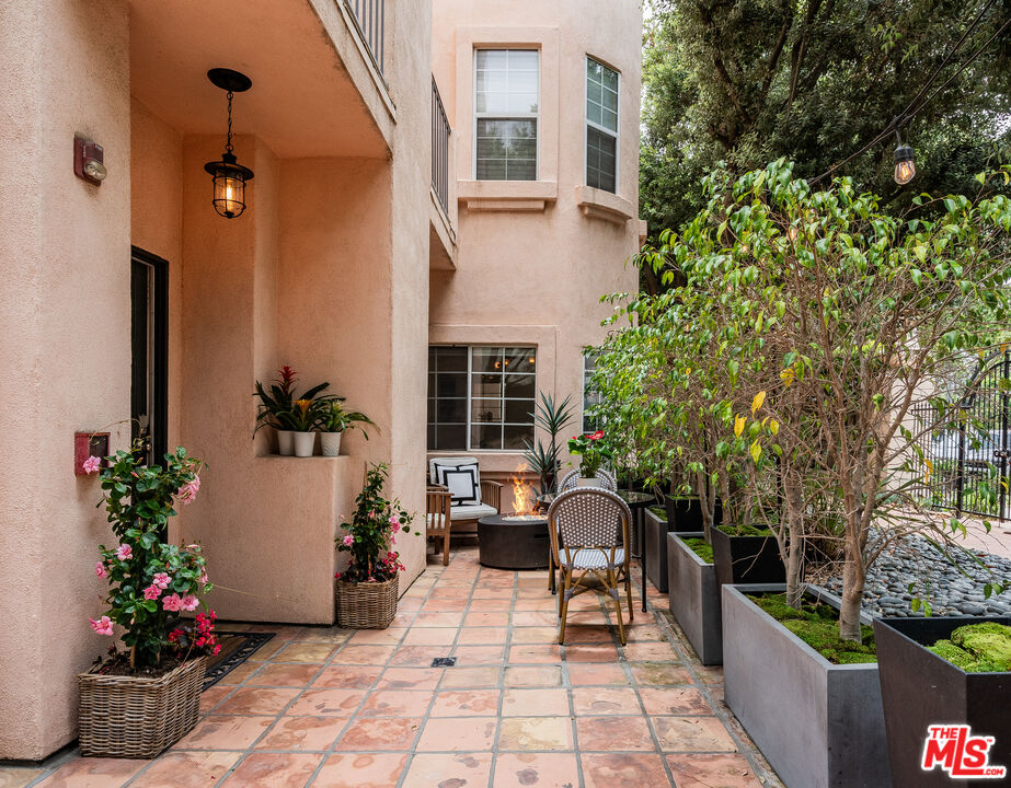 1531 12th Street, Unit 1 Santa Monica, CA 90401 - Photo 4 of 21 a view of a porch with chairs and potted plants