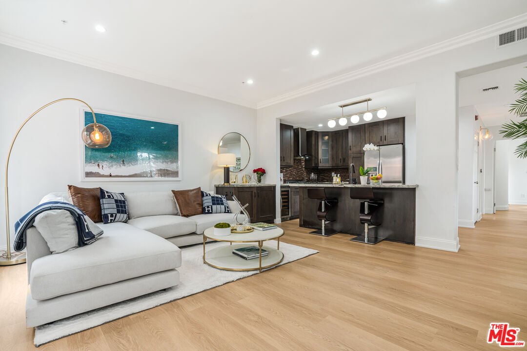 1531 12th Street, Unit 1 Santa Monica, CA 90401 - Photo 6 of 21 a living room with furniture and a flat screen tv