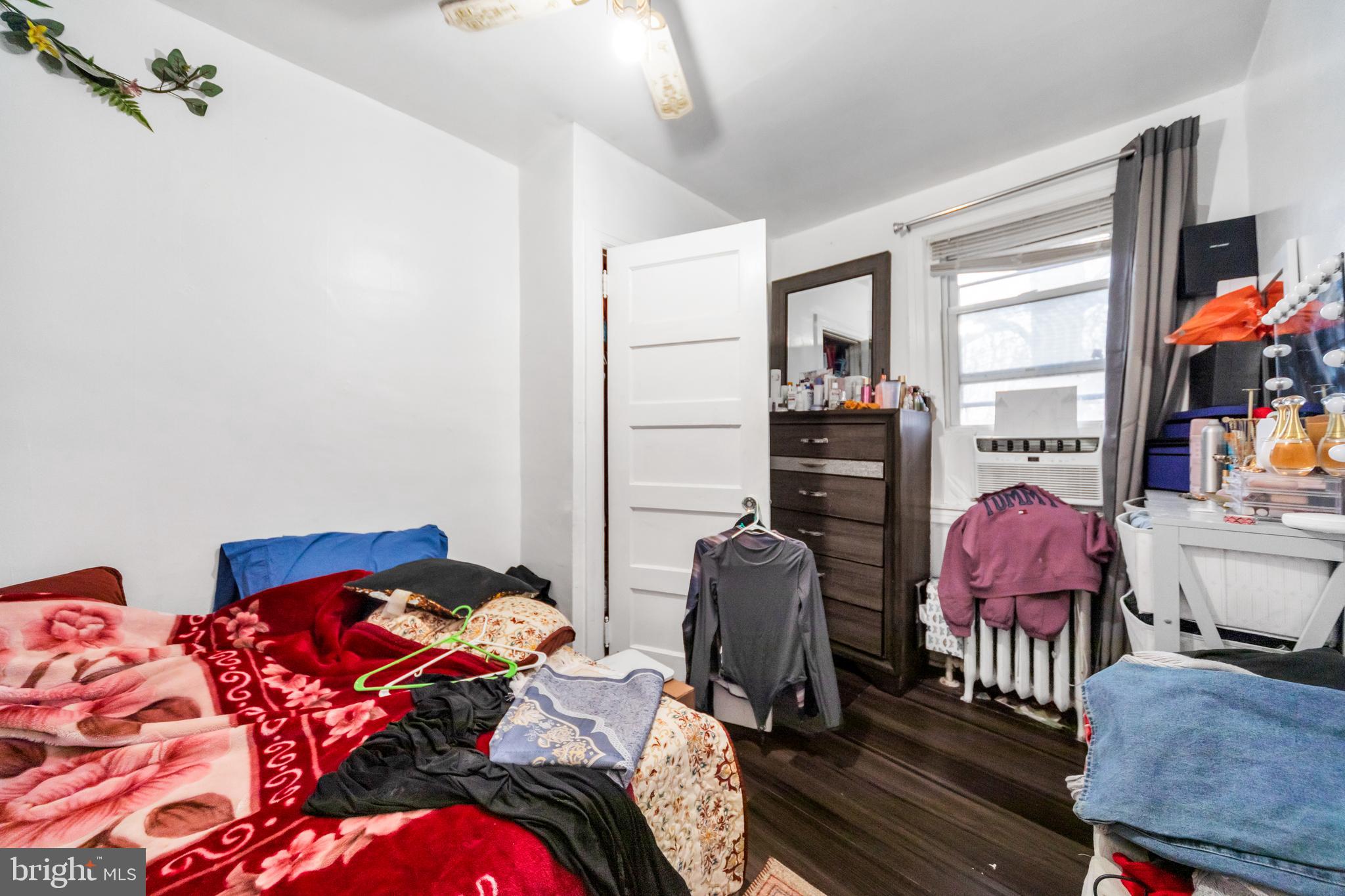 7517 Parkview Road Upper Darby, PA 19082 - Photo 12 of 33 a bedroom with a bed and wooden floor