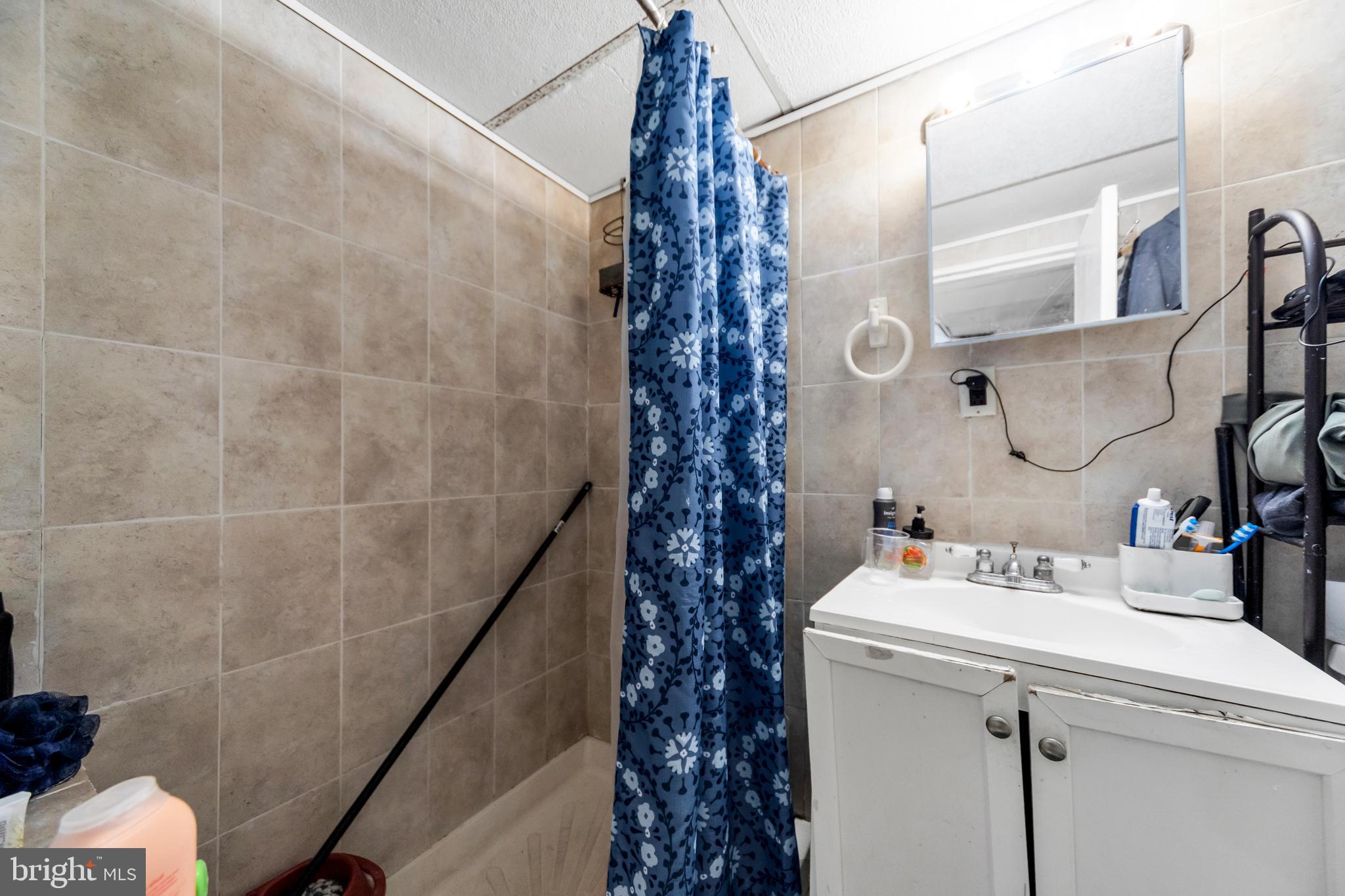 7517 Parkview Road Upper Darby, PA 19082 - Photo 19 of 33 a bathroom with a sink and a mirror