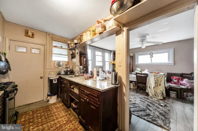 a kitchen with a stove a sink and a refrigerator