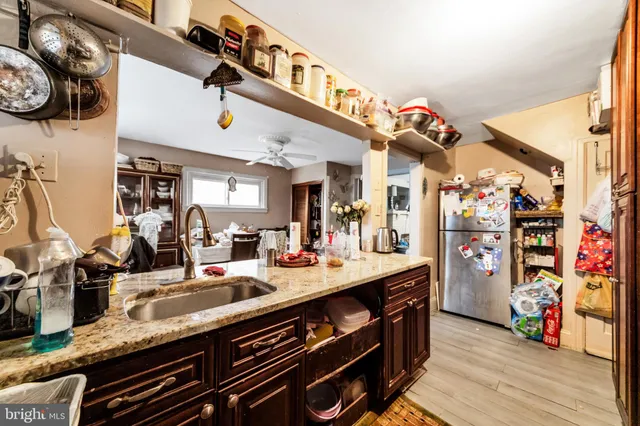 a kitchen with stainless steel appliances granite countertop a sink and cabinets