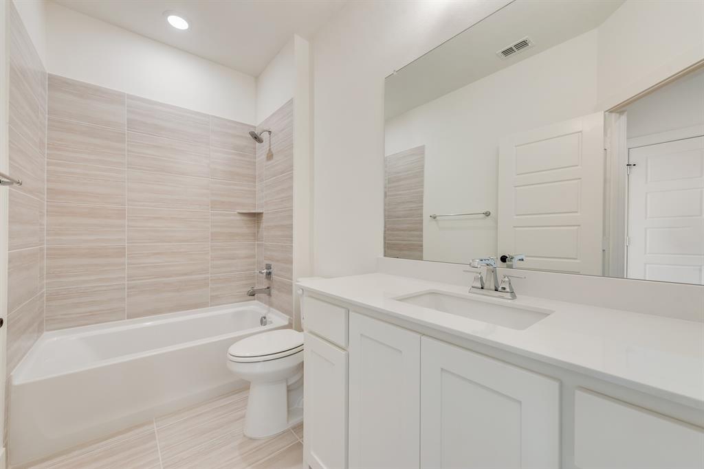 16396 Parish Lane Frisco, TX 75033 - Photo 24 of 35 a bathroom with a sink a toilet and shower
