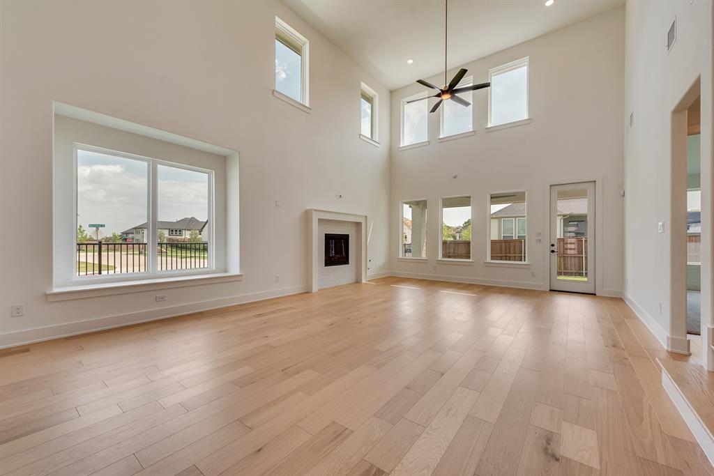 16396 Parish Lane Frisco, TX 75033 - Photo 9 of 35 a view of an empty room with window and wooden floor