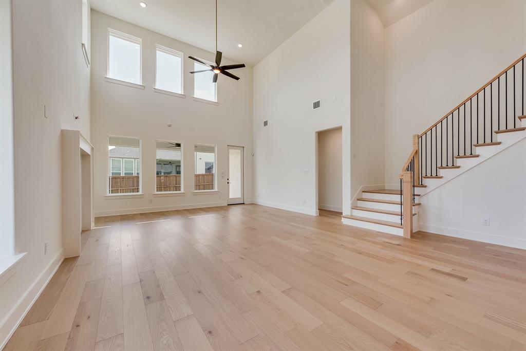 16396 Parish Lane Frisco, TX 75033 - Photo 10 of 35 a view of an empty room with wooden floor and a window