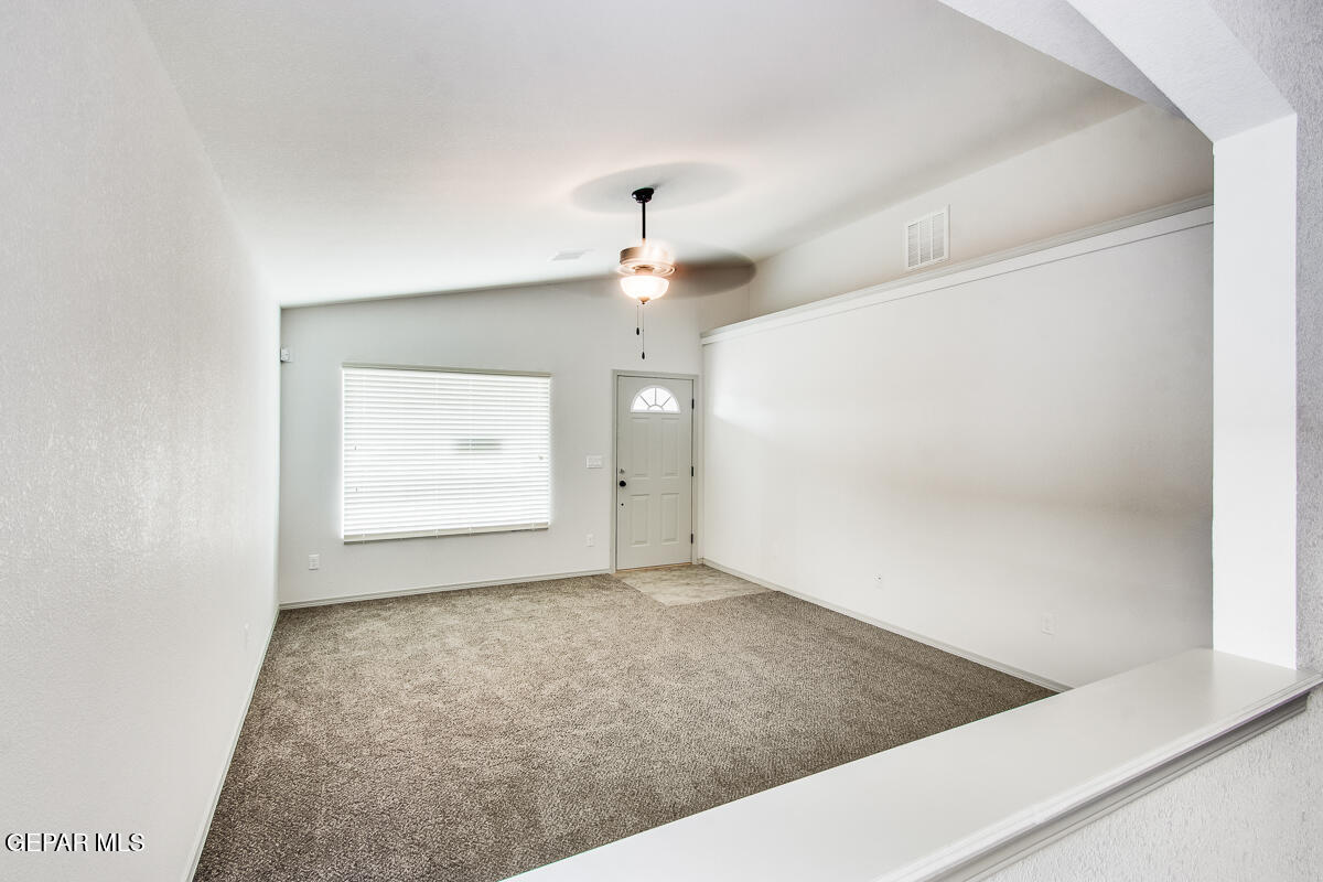 12420 Oconee Place Clint, TX 79836 - Photo 16 of 27 an empty room with a empty space and windows