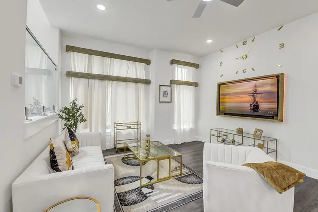 a large kitchen with kitchen island a island a sink a stove a dining table and chairs