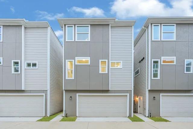 a front view of a house with a garage
