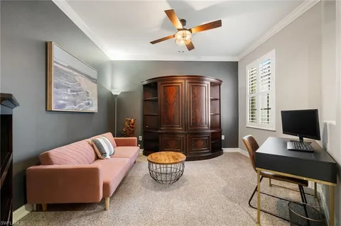a bedroom with furniture and a flat screen tv