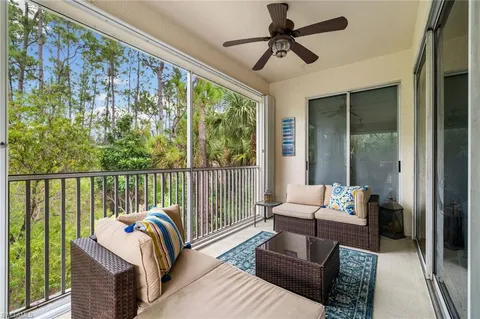 a dining room with furniture window and outside view