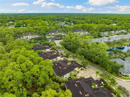 an aerial view of a house with a lake view