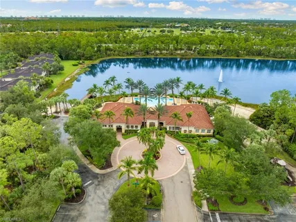 a view of a lake with a houses in the back
