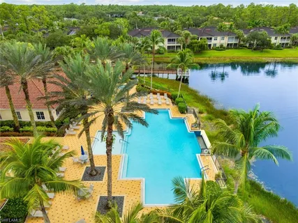 an aerial view of a houses with a yard
