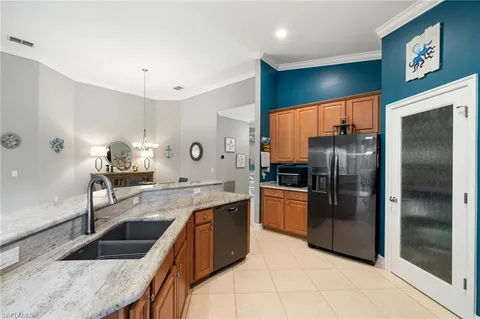 a living room with furniture a flat screen tv and a large window