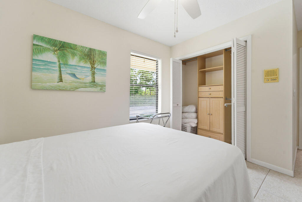 5562 Reynolds Road Lake Worth, FL 33449 - Photo 19 of 39 a bedroom with a bed and a window