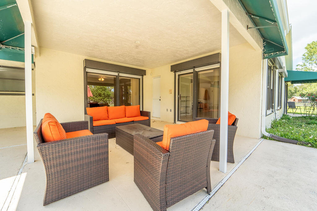 5562 Reynolds Road Lake Worth, FL 33449 - Photo 31 of 39 view of an outdoor sitting area