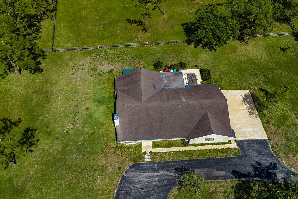 5562 Reynolds Road Lake Worth, FL 33449 - Photo 37 of 39 a view of a back yard of the house with a yard