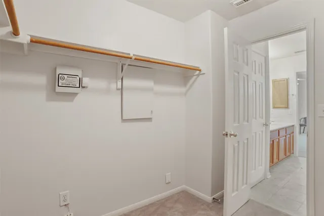 a view of a room with rack on the wall