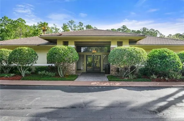 front view of house with potted plants