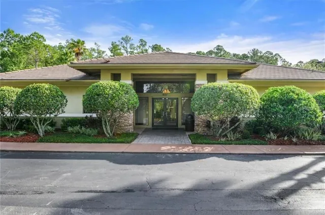 front view of house with potted plants