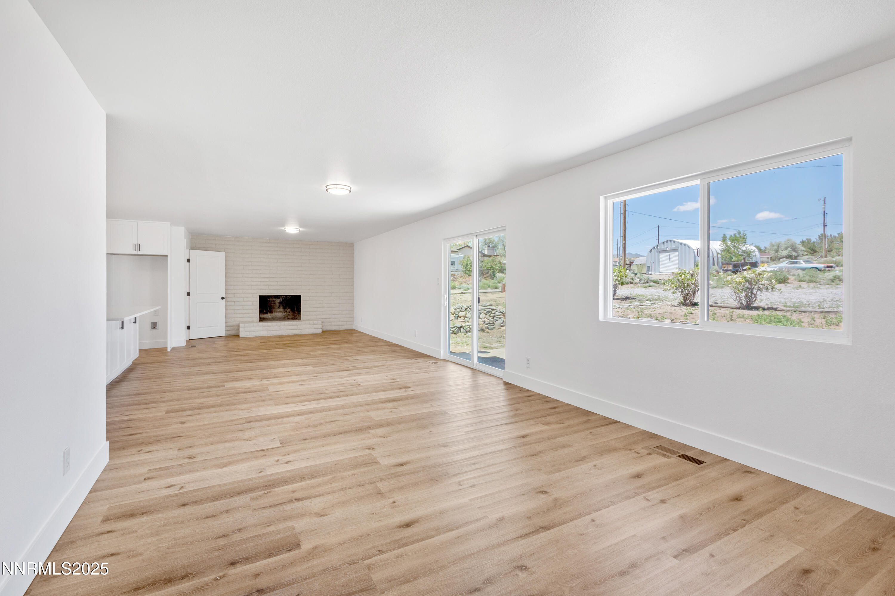 10835 Silver Knolls Boulevard Reno, NV 89508 - Photo 13 of 43 a view of empty room with wooden floor and window