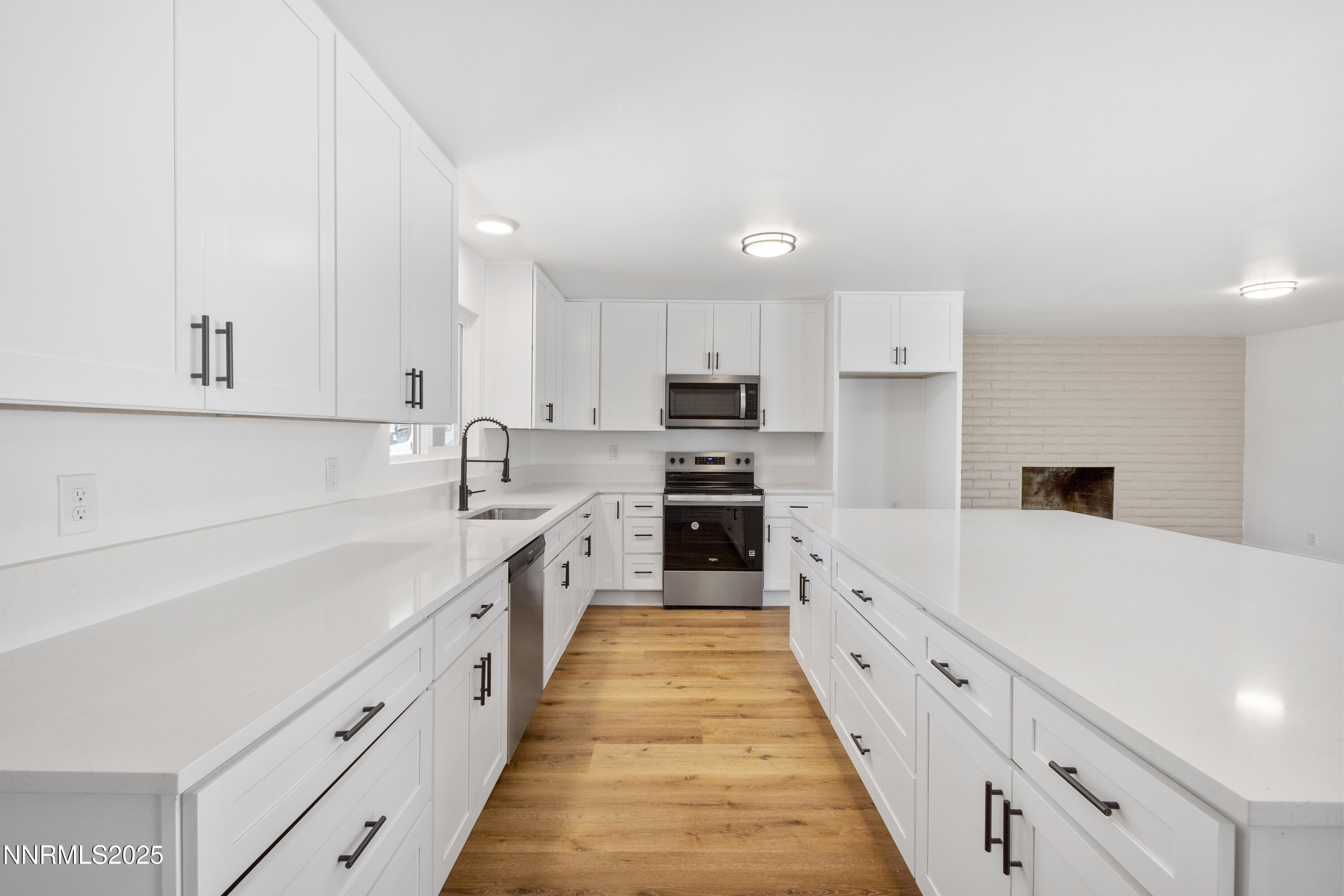 10835 Silver Knolls Boulevard Reno, NV 89508 - Photo 20 of 43 a large white kitchen with cabinets