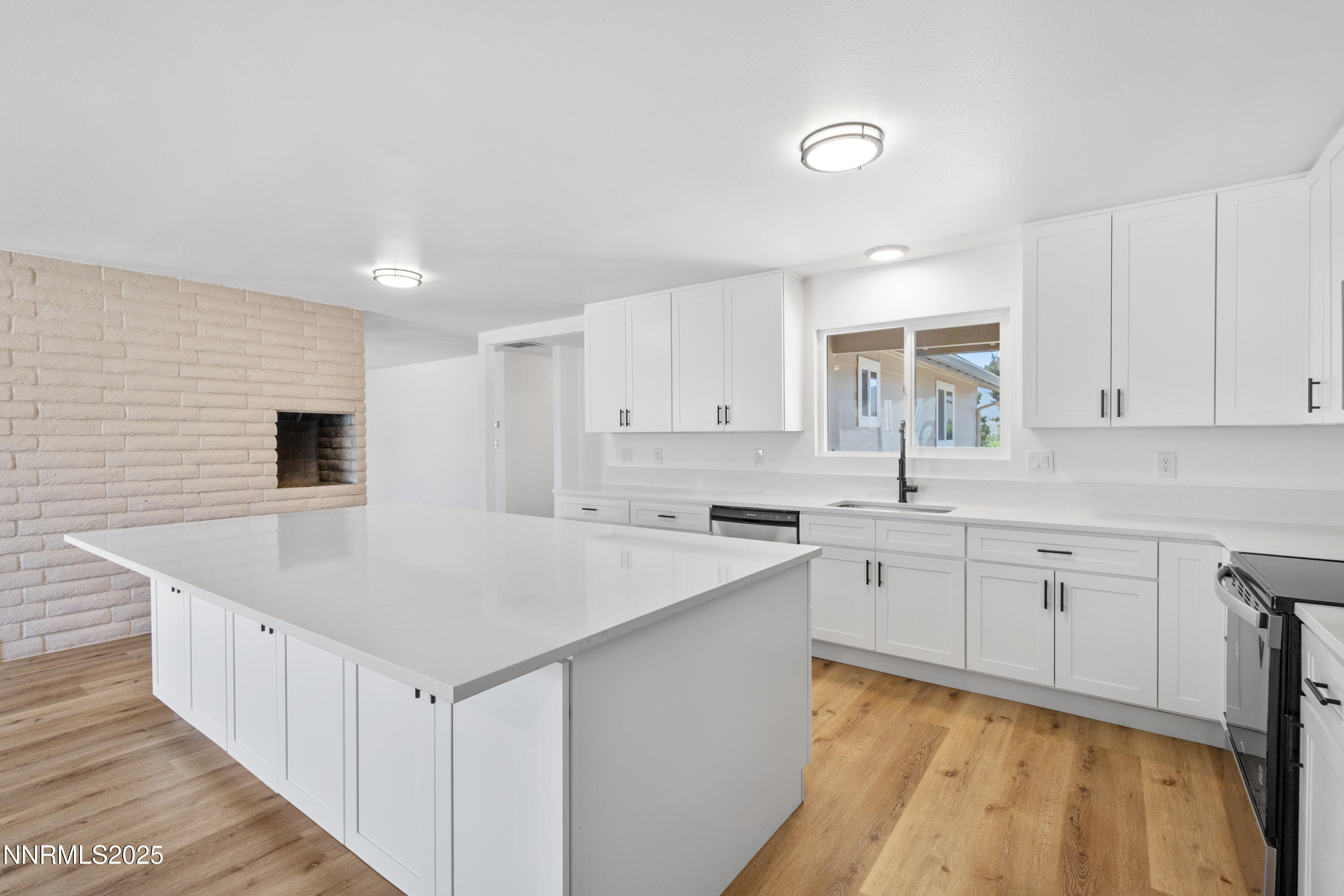 10835 Silver Knolls Boulevard Reno, NV 89508 - Photo 21 of 43 a kitchen with sink cabinets and wooden floor