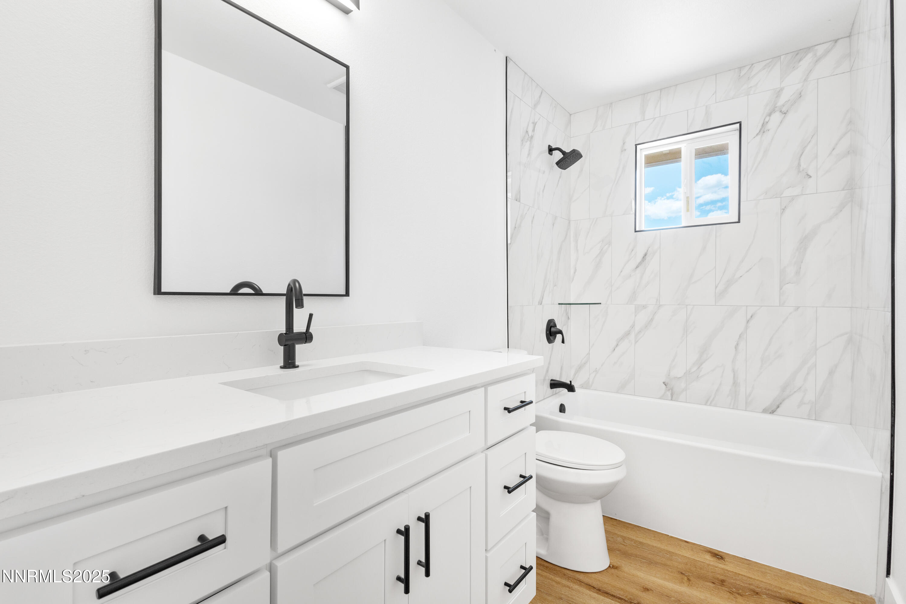 10835 Silver Knolls Boulevard Reno, NV 89508 - Photo 29 of 43 a bathroom with a granite countertop sink a toilet and a bathtub