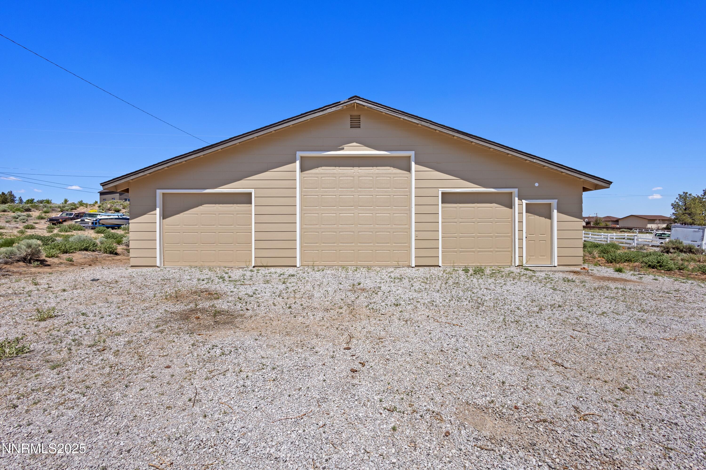 10835 Silver Knolls Boulevard Reno, NV 89508 - Photo 33 of 43 a view of a house with a backyard