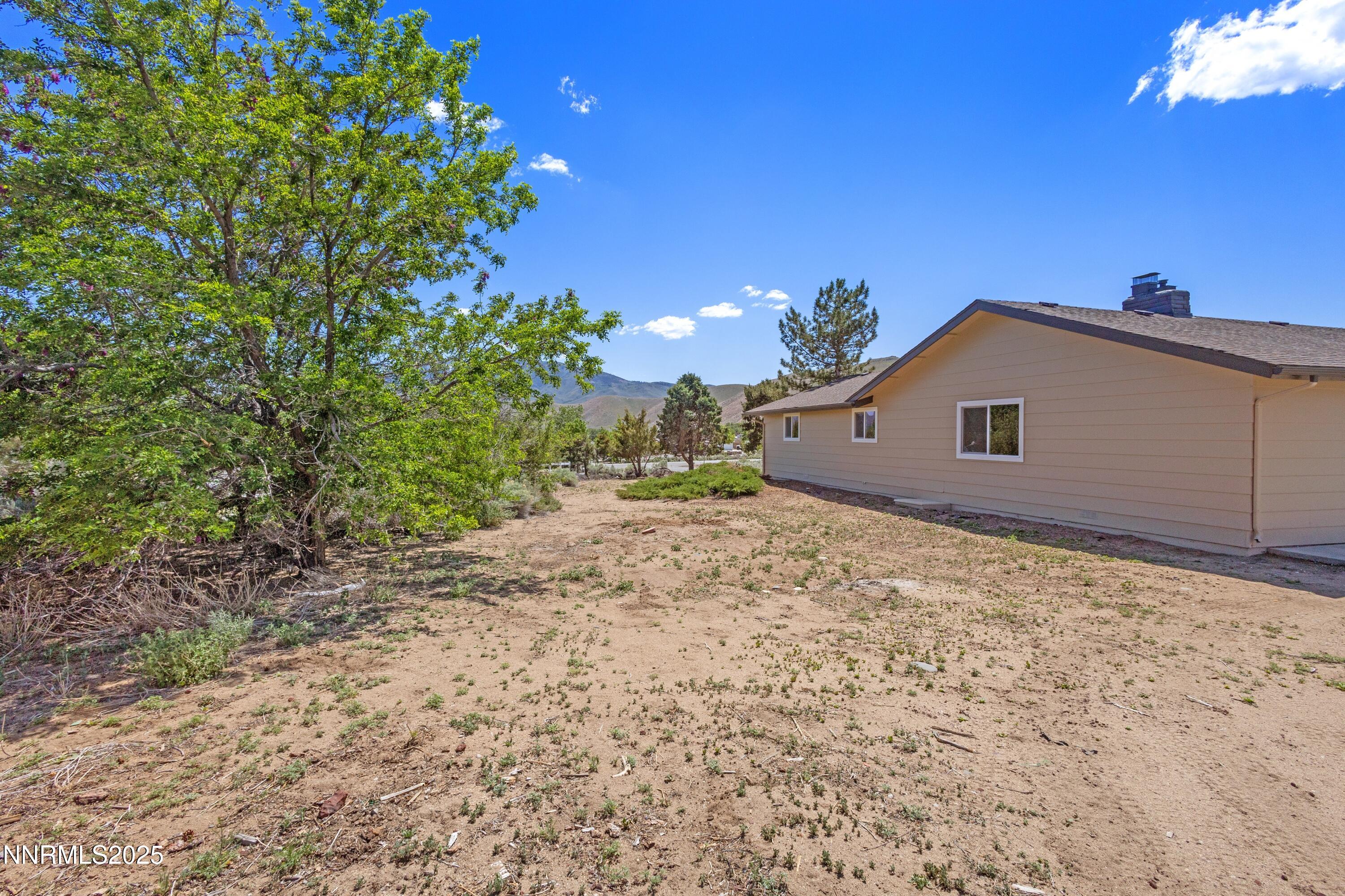 10835 Silver Knolls Boulevard Reno, NV 89508 - Photo 37 of 43 a view of a house with a yard