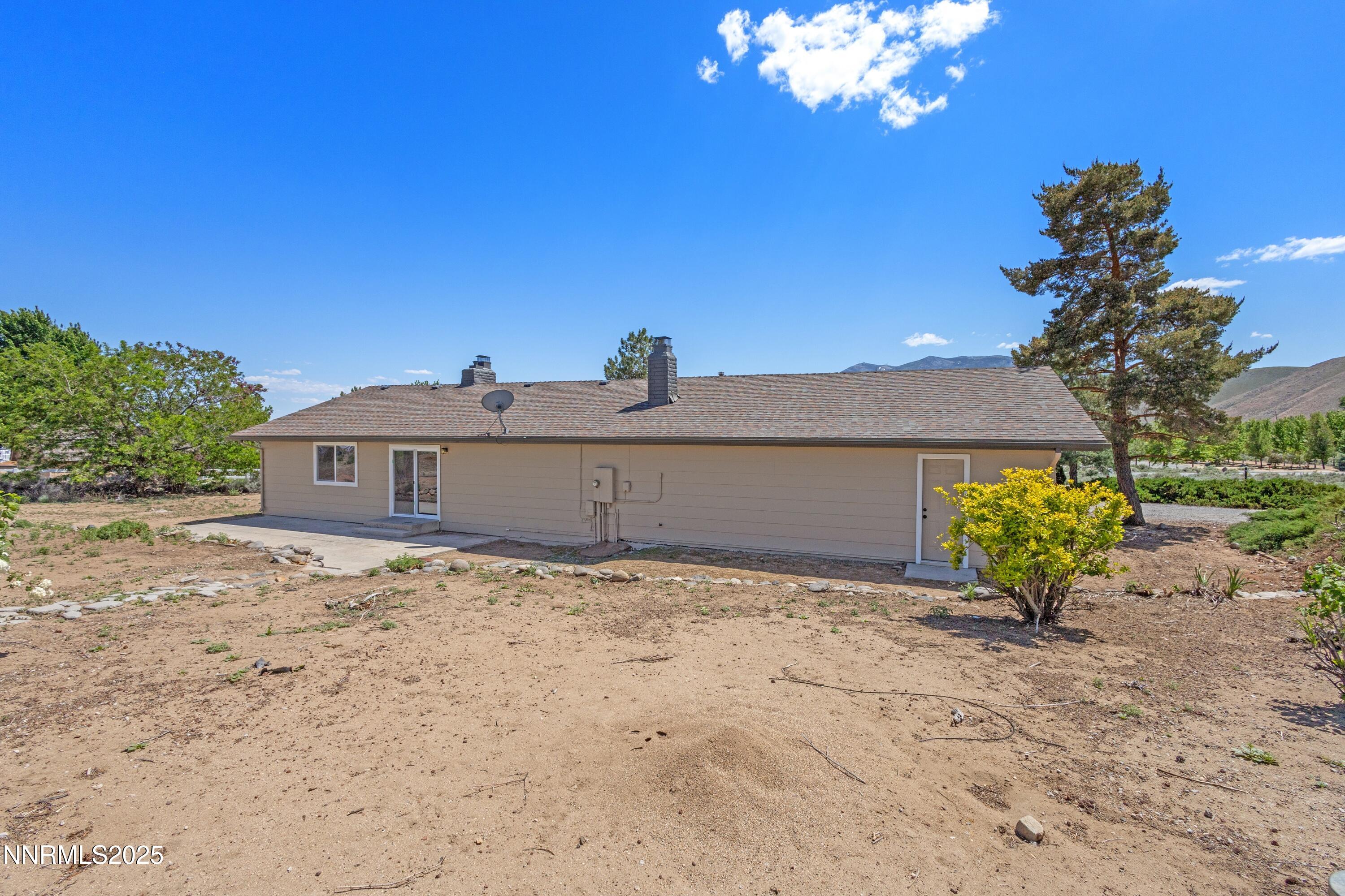 10835 Silver Knolls Boulevard Reno, NV 89508 - Photo 38 of 43 a view of a house with a yard