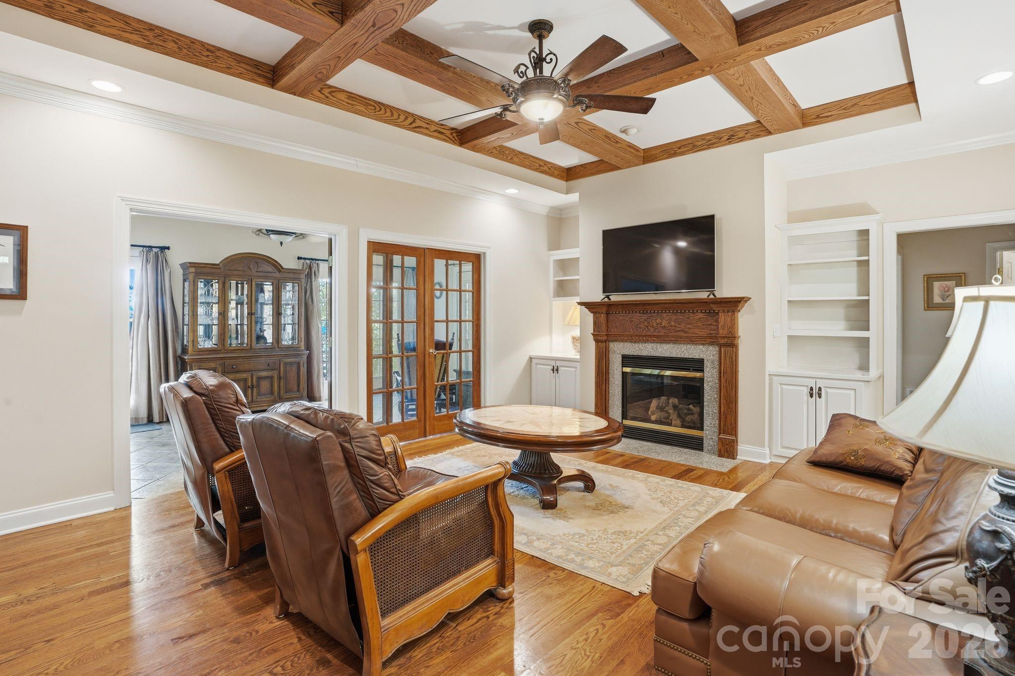 2275 River Road Richfield, NC 28137 - Photo 12 of 44 a living room with furniture a flat screen tv and a fireplace