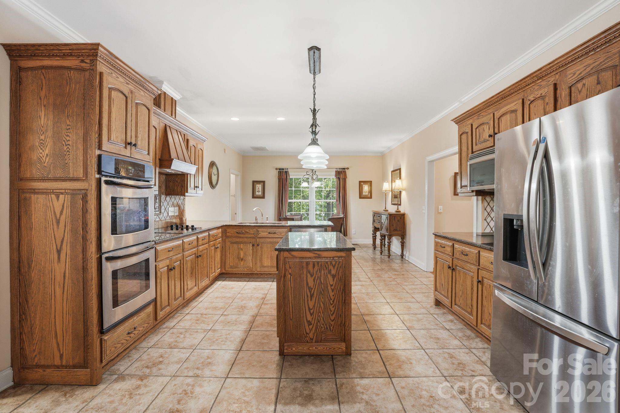 2275 River Road Richfield, NC 28137 - Photo 16 of 44 a kitchen with stainless steel appliances granite countertop a refrigerator and a sink