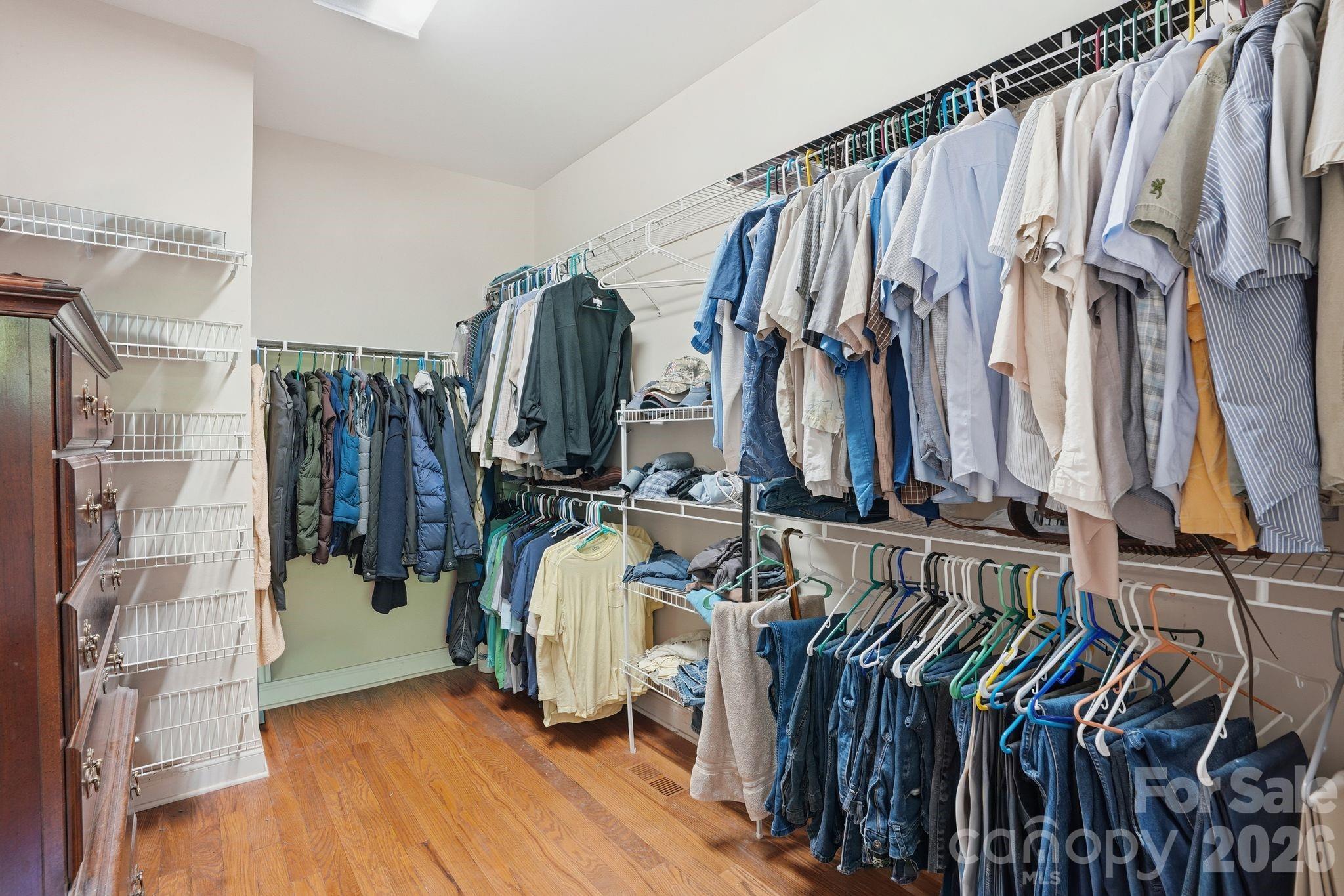 2275 River Road Richfield, NC 28137 - Photo 23 of 44 a view of walk in closet with clothes and shoes