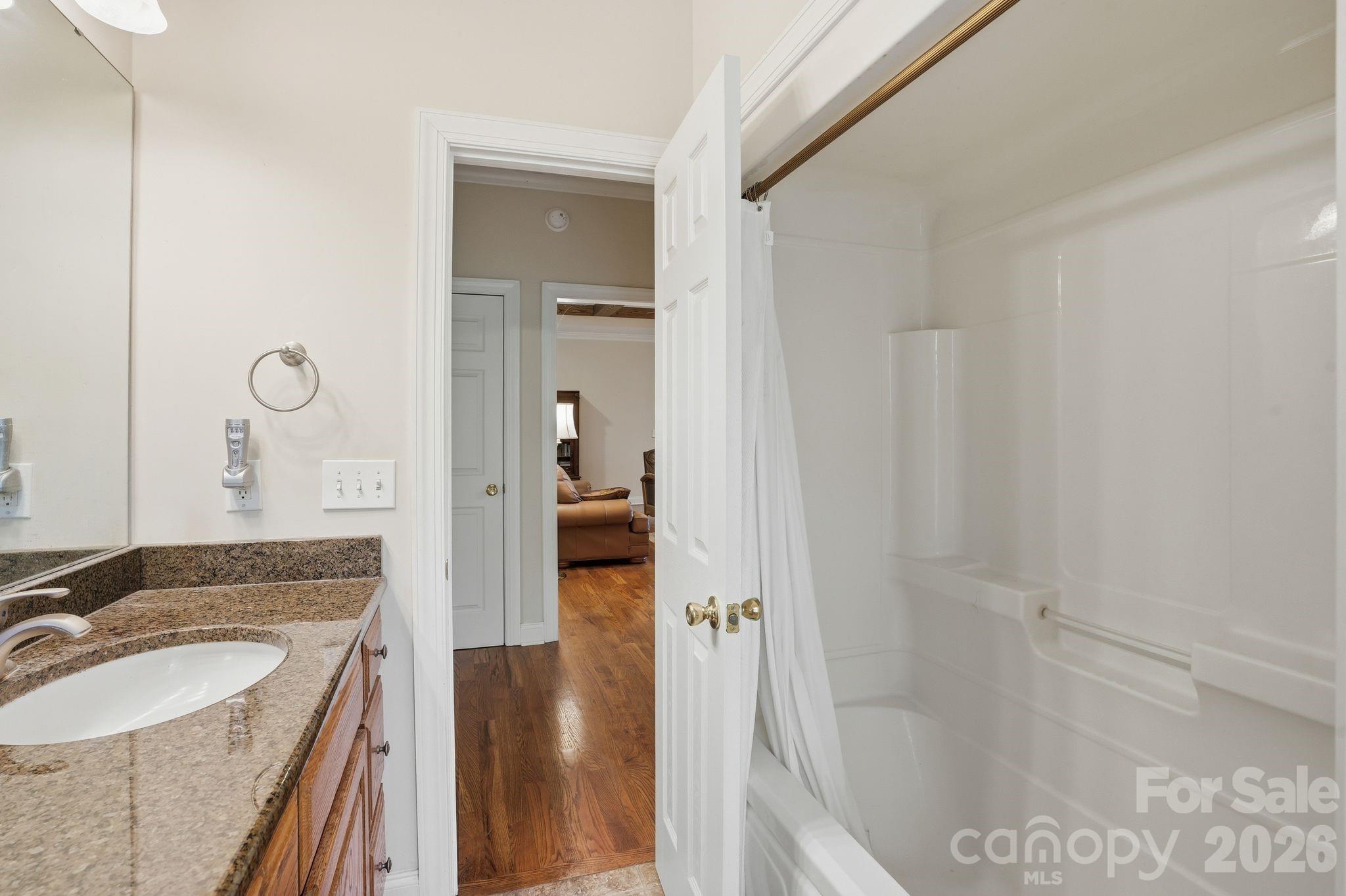 2275 River Road Richfield, NC 28137 - Photo 27 of 44 a en suite bathroom with a granite countertop sink and a mirror